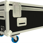 Back view of large black and white flight case with wheels on a white background