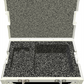 Silver hard-shell case with black interior foam on a white background
