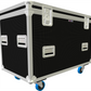 Black flight case with silver handles and blue wheels on a white background