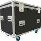 Dark Grey and silver flight case with wheels on a white background