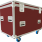 Red flight case with white trim and blue wheels on a white background
