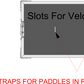 Diagram showing slots for velcro on a door with text indicating where to fit velcro straps for paddles.